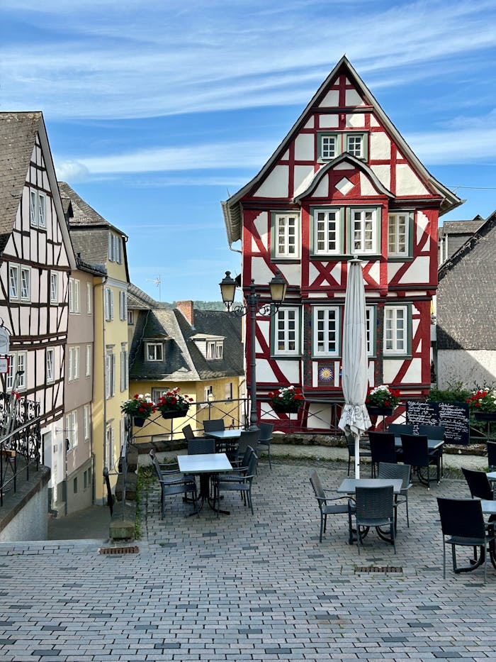 Mastering the First Impression: Your intriguing post title goes here Picturesque timber-framed house in a charming European street setting.